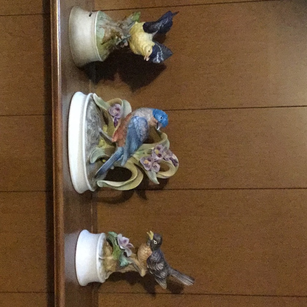 Three ceramic statues of aviary friends - birds